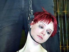 Brutal facial torment in a dark dungeon. The girl is terrified by the Master sadist
